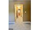 Hallway featuring tan walls and carpet, with multiple white doors leading to rooms at 2567 Laurel Nw Cir, Atlanta, GA 30311