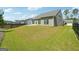 Large backyard with grassy area, privacy fence, and patio at 361 Elkins Pl, Peachtree City, GA 30269