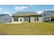 Private backyard with a patio and a spacious grassy area at 361 Elkins Pl, Peachtree City, GA 30269