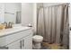 Clean bathroom with white vanity and shower/tub combo at 361 Elkins Pl, Peachtree City, GA 30269