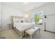 Bright bedroom with a queen-size bed and neutral decor at 361 Elkins Pl, Peachtree City, GA 30269