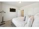 Spacious bedroom with a queen bed and TV at 361 Elkins Pl, Peachtree City, GA 30269