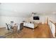 Spacious bonus room with hardwood floors, seating area, and dining table at 361 Elkins Pl, Peachtree City, GA 30269
