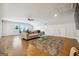 Relaxing bonus room with hardwood floors, sectional sofa and a large rug at 361 Elkins Pl, Peachtree City, GA 30269