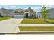New construction home with curb appeal and stone accents at 361 Elkins Pl, Peachtree City, GA 30269