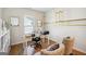 Bright home office with built-in shelves and hardwood floors at 361 Elkins Pl, Peachtree City, GA 30269