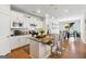 Open concept kitchen with island and stainless steel appliances at 361 Elkins Pl, Peachtree City, GA 30269
