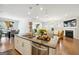 Modern kitchen with large island, stainless steel appliances and granite countertop at 361 Elkins Pl, Peachtree City, GA 30269