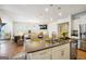 Open concept kitchen with granite island and stainless steel appliances at 361 Elkins Pl, Peachtree City, GA 30269