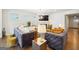 Open living room with hardwood floors and fireplace at 361 Elkins Pl, Peachtree City, GA 30269