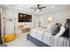 King-size bed, large TV, and en-suite bathroom access at 361 Elkins Pl, Peachtree City, GA 30269