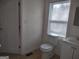 Simple bathroom with toilet and sink vanity at 41 W Main St, Hampton, GA 30228