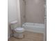 Bathroom with tiled shower and linoleum floor at 41 W Main St, Hampton, GA 30228