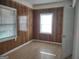 Bedroom with wood paneled walls and window at 41 W Main St, Hampton, GA 30228