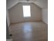 Bright bedroom with laminate flooring and a window at 41 W Main St, Hampton, GA 30228