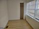 Bright bedroom with large windows and a closet at 41 W Main St, Hampton, GA 30228