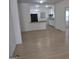 Open concept dining room and kitchen with light flooring at 41 W Main St, Hampton, GA 30228