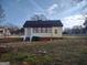 Rear view of the house, showing a side entrance and yard space at 41 W Main St, Hampton, GA 30228