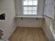 Small laundry area with built-in counter space at 41 W Main St, Hampton, GA 30228