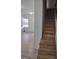 Wooden staircase leading to the second floor at 41 W Main St, Hampton, GA 30228