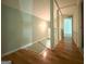 Upper hallway with wood floors and access to bedrooms at 5125 2Nd St, Morrow, GA 30260