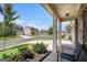 Inviting front porch view with supportive columns and a view of the street and surrounding neighborhood at 435 Auburn Crossing Dr, Auburn, GA 30011