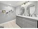 Stylish bathroom features a double vanity, marble countertop, and modern fixtures at 107 Stratford Ct, Peachtree City, GA 30269