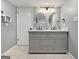 Elegant bathroom with double vanity, marble countertop, and modern fixtures at 107 Stratford Ct, Peachtree City, GA 30269