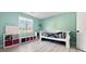 The bedroom features a sunny window and updated laminate flooring and offers plenty of storage at 107 Stratford Ct, Peachtree City, GA 30269
