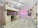 Spacious bedroom features a loft bed, built-in desk, and pink walls at 107 Stratford Ct, Peachtree City, GA 30269