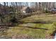 View of backyard with wooded area and out building at 125 Oak Leaf Dr, Stockbridge, GA 30281