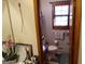 Bathroom with a toilet, shelf, and sink, with natural light coming through a window at 125 Oak Leaf Dr, Stockbridge, GA 30281