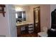 Bathroom featuring vanity with a large mirror, plus a chair and storage unit at 125 Oak Leaf Dr, Stockbridge, GA 30281