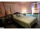 Bedroom with queen-sized bed, pastel walls, and decor accents provides cozy retreat at 125 Oak Leaf Dr, Stockbridge, GA 30281