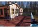 View of house from wood deck with chairs at 125 Oak Leaf Dr, Stockbridge, GA 30281