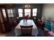 Traditional dining room featuring a large table, china cabinet, and bay window at 125 Oak Leaf Dr, Stockbridge, GA 30281