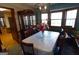 Traditional dining room featuring a large table, china cabinet, and bay window at 125 Oak Leaf Dr, Stockbridge, GA 30281