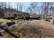 Charming home featuring a well-maintained exterior and a tranquil, natural yard at 125 Oak Leaf Dr, Stockbridge, GA 30281