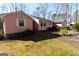 Well-kept home exterior complemented by green space and natural landscaping at 125 Oak Leaf Dr, Stockbridge, GA 30281