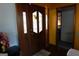 Foyer featuring wood floors, decorative front door, and access to other rooms at 125 Oak Leaf Dr, Stockbridge, GA 30281