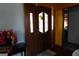 Foyer featuring wood floors, decorative front door, and access to other rooms at 125 Oak Leaf Dr, Stockbridge, GA 30281