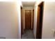 Hallway with carpeting, wooden door frames, and natural light, creates an inviting path at 125 Oak Leaf Dr, Stockbridge, GA 30281
