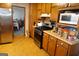 Updated kitchen with stainless steel appliances, wood cabinets and a convenient stove top at 125 Oak Leaf Dr, Stockbridge, GA 30281