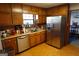 Kitchen with stainless steel refrigerator, wood cabinets and a convenient double sink at 125 Oak Leaf Dr, Stockbridge, GA 30281