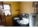 Functional laundry room with modern washing machine and dryer, plus convenient storage at 125 Oak Leaf Dr, Stockbridge, GA 30281