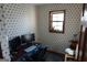 Small office features wallpaper and window, desk and ergonomic chair with decor at 125 Oak Leaf Dr, Stockbridge, GA 30281