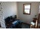 Small office features wallpaper and window, desk and ergonomic chair with decor at 125 Oak Leaf Dr, Stockbridge, GA 30281