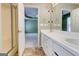 Bathroom leading into Primary bedroom area featuring double sinks, shower, and linen closet at 25 Brookstone Ct, Covington, GA 30016