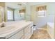 Bright bathroom featuring a double sink vanity, neutral tones, and a clean functional layout at 25 Brookstone Ct, Covington, GA 30016