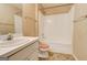 Clean bathroom with a shower-tub combo and neutral-toned fixtures at 25 Brookstone Ct, Covington, GA 30016